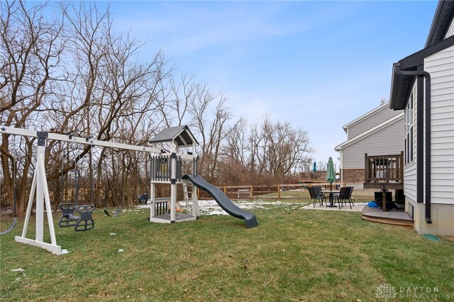 view of yard featuring a playground and a patio area