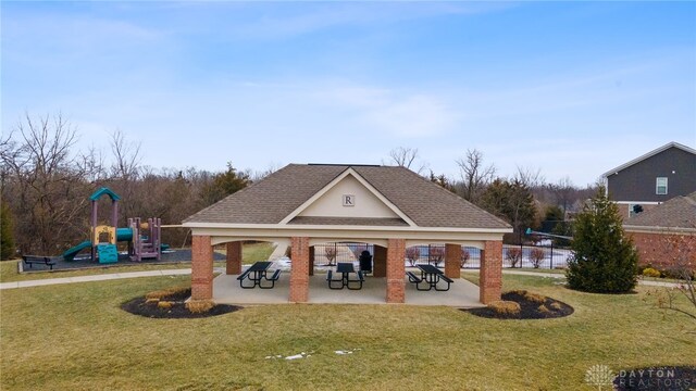 view of community with a playground and a yard