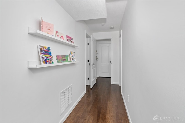 corridor featuring dark wood-type flooring