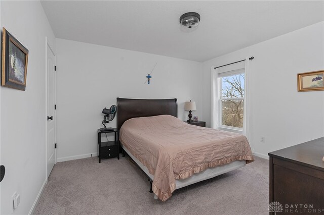 bedroom with light carpet