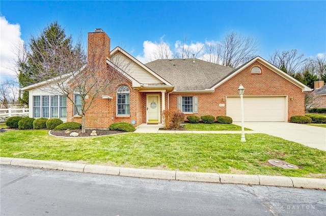 view of front facade featuring a garage and a front lawn