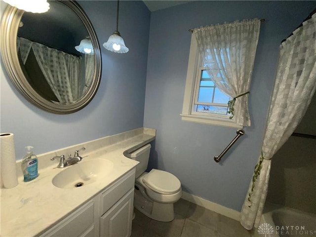 bathroom featuring walk in shower, tile patterned floors, vanity, and toilet