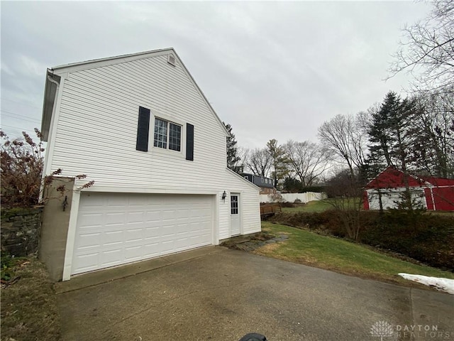 view of side of home with a garage