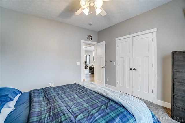 carpeted bedroom with a closet and ceiling fan