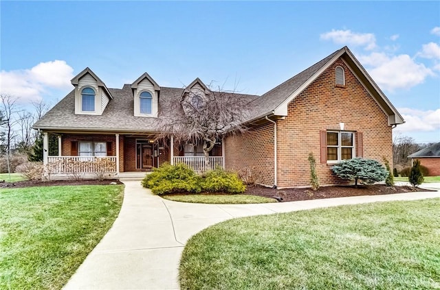 view of front of home featuring a porch and a front yard