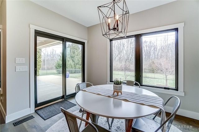 dining space featuring a chandelier