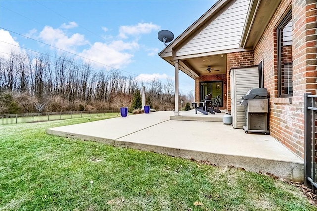 view of patio featuring ceiling fan and a grill