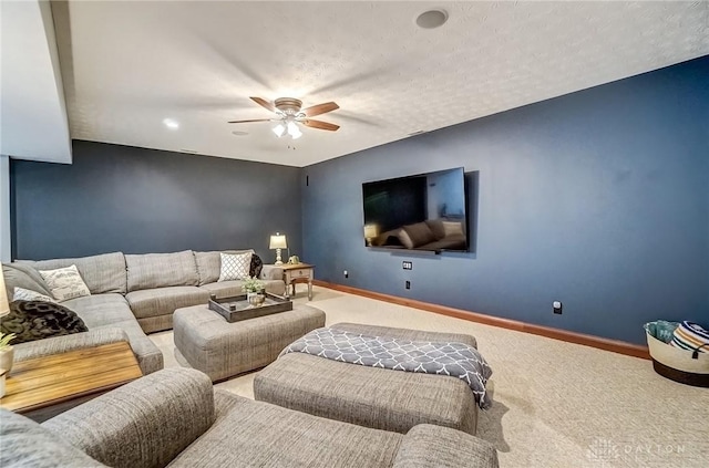 carpeted living room featuring a textured ceiling and ceiling fan