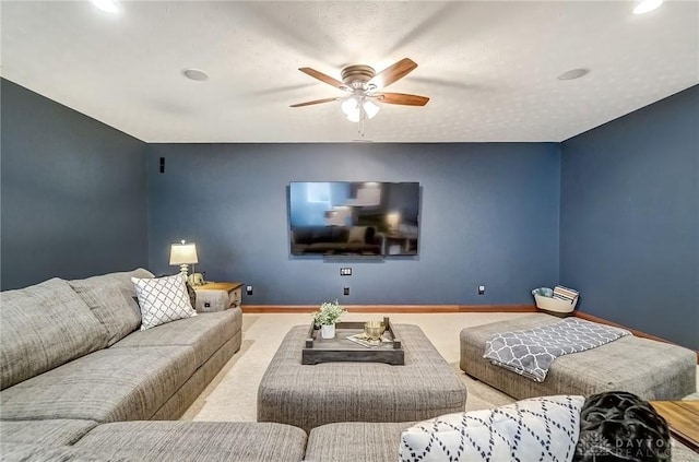 carpeted living room featuring ceiling fan