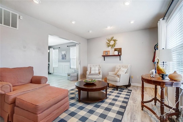 living room with light hardwood / wood-style floors