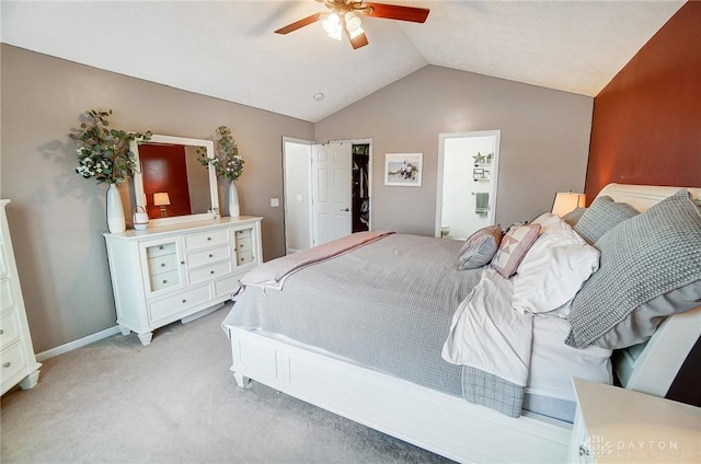 carpeted bedroom featuring vaulted ceiling and ceiling fan