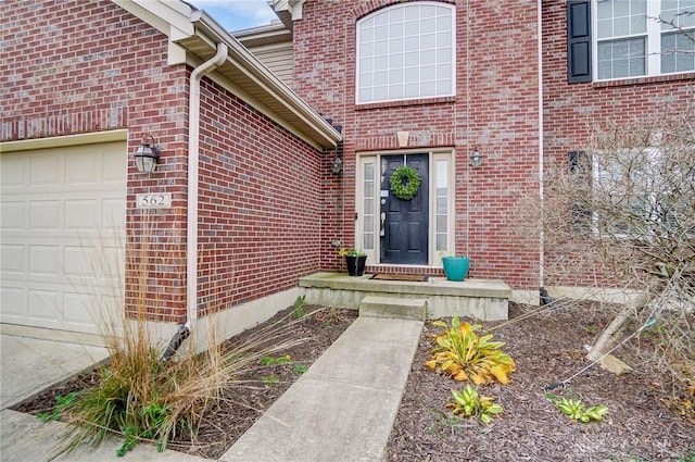 view of exterior entry with a garage