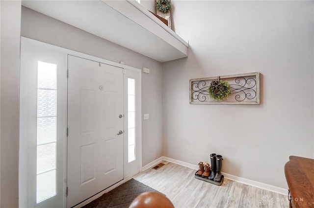 foyer featuring wood-type flooring