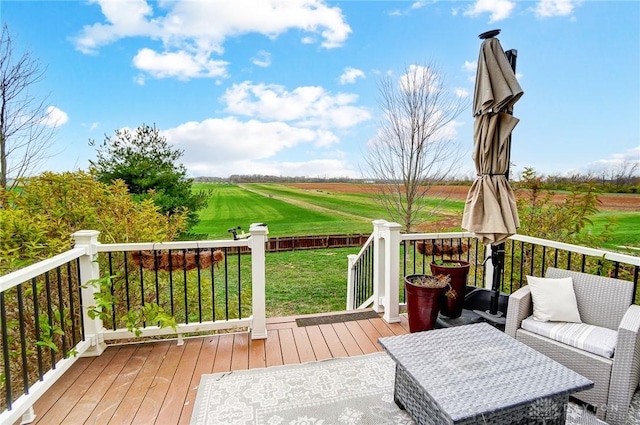 wooden deck featuring a yard