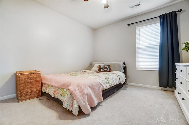 bedroom with light colored carpet and ceiling fan