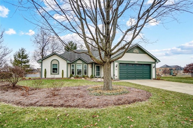 ranch-style house featuring a garage and a front lawn