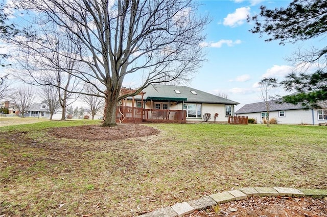 view of yard featuring a wooden deck