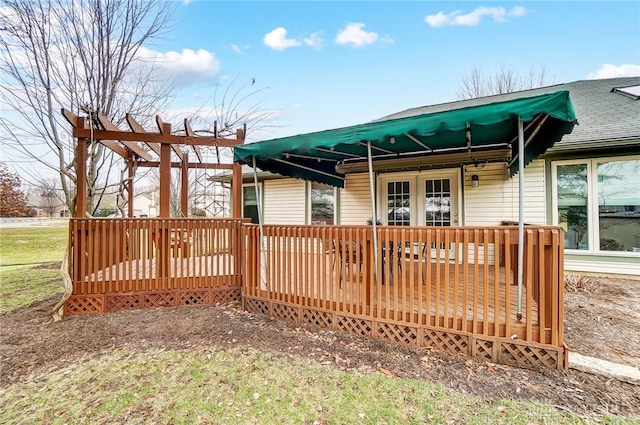 rear view of property featuring a deck