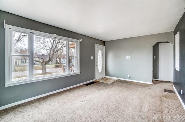 entrance foyer featuring carpet flooring