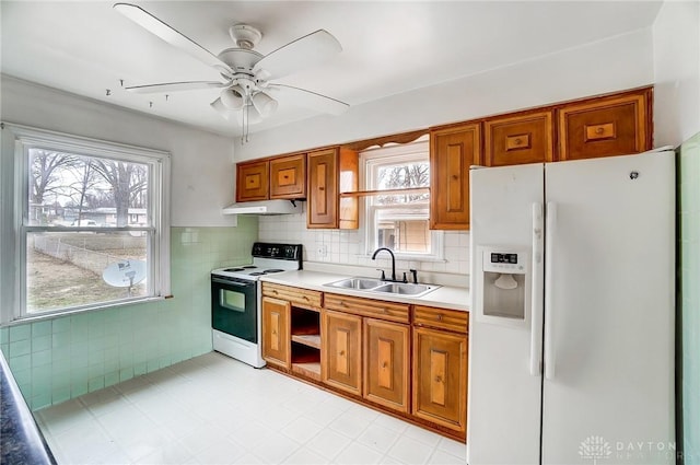 kitchen with ceiling fan, white appliances, and sink