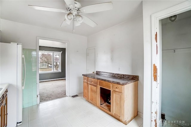 kitchen with white refrigerator and ceiling fan