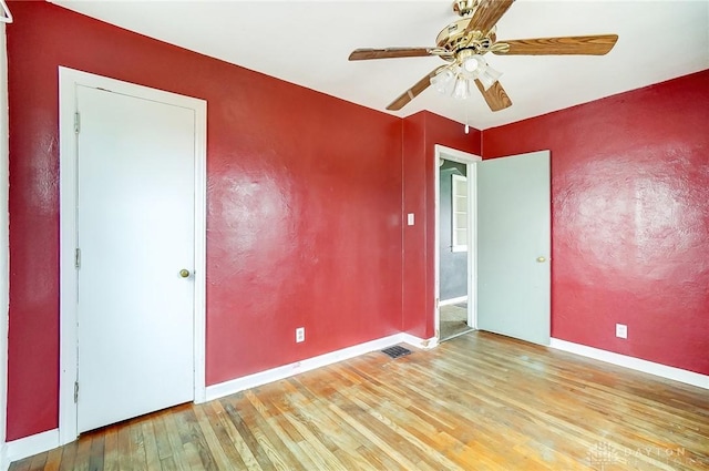 spare room with ceiling fan and light hardwood / wood-style floors