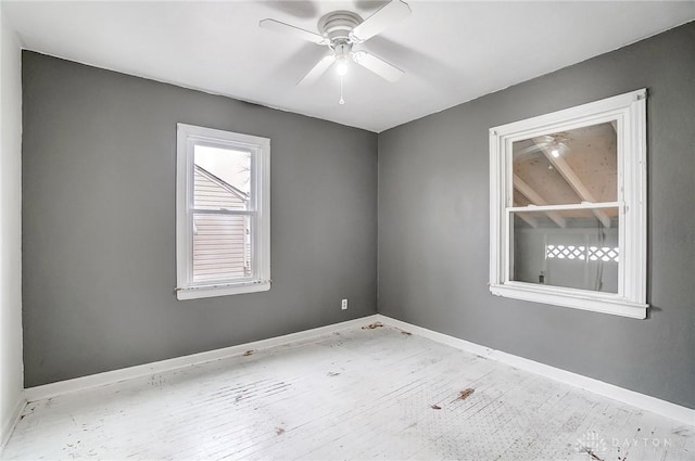 spare room with ceiling fan