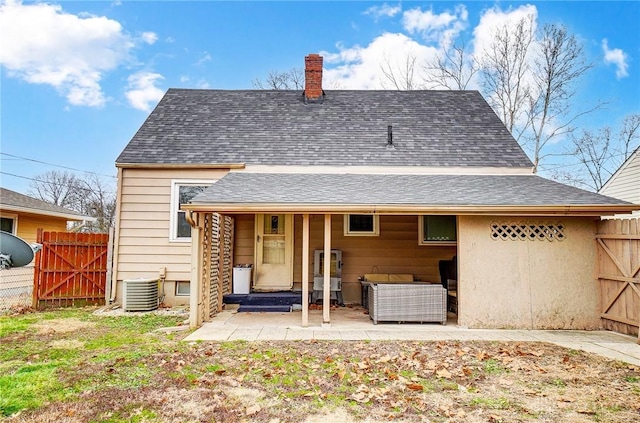 back of property featuring central AC, an outdoor living space, and a patio