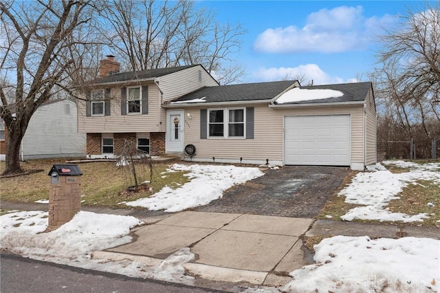 split level home featuring a garage