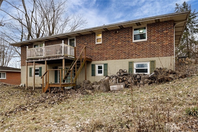 back of property featuring a wooden deck