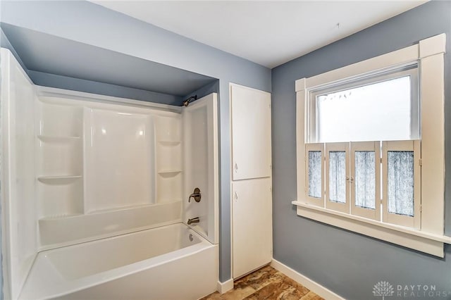 bathroom featuring washtub / shower combination