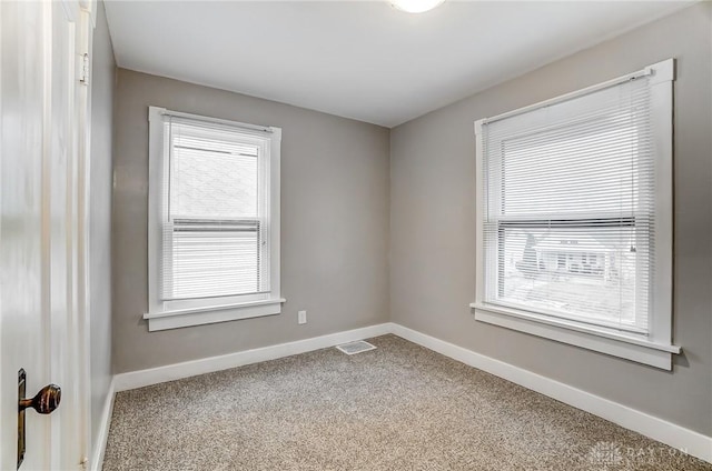 unfurnished room with carpet floors