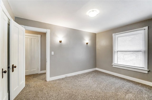 empty room featuring light carpet