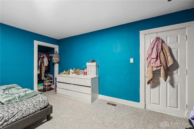 carpeted bedroom with a closet