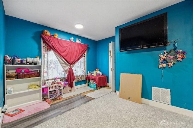 playroom with wood-type flooring