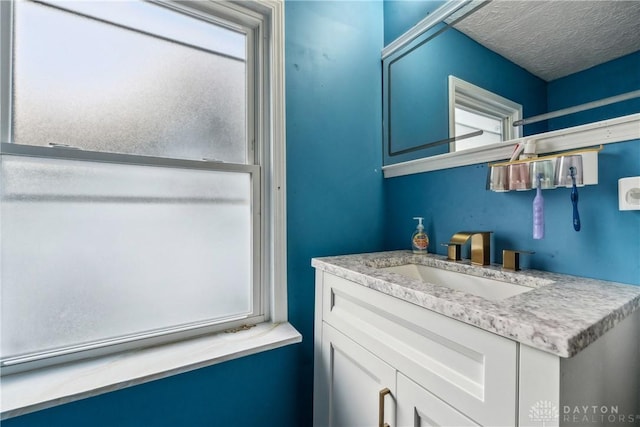 bathroom featuring vanity and a textured ceiling