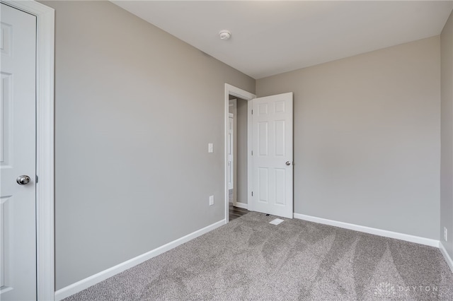 unfurnished bedroom featuring carpet