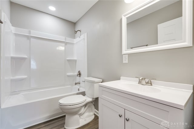 full bathroom featuring vanity, toilet, bathing tub / shower combination, and wood-type flooring