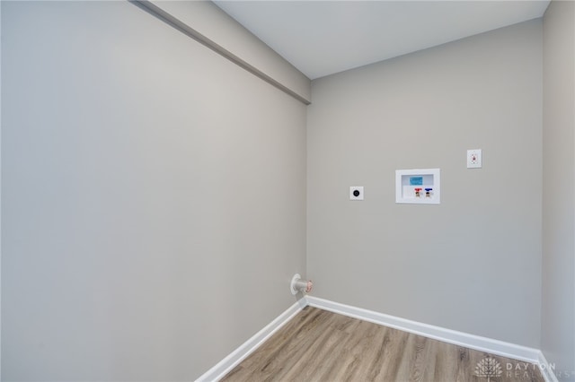 laundry area with hookup for a washing machine, hookup for an electric dryer, and hardwood / wood-style flooring