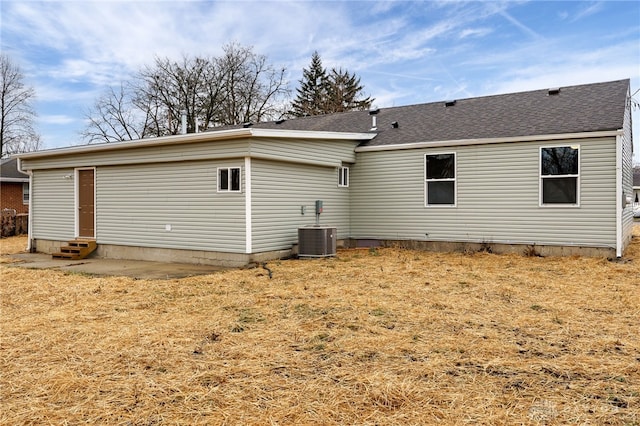 rear view of house featuring central AC