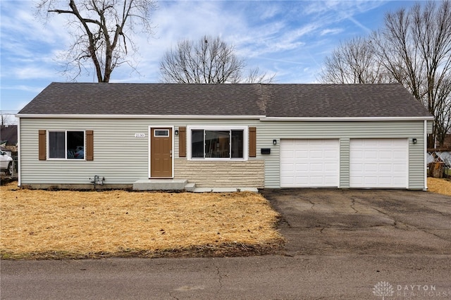 single story home with a garage