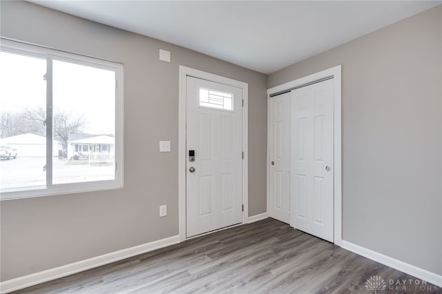 entryway with hardwood / wood-style floors