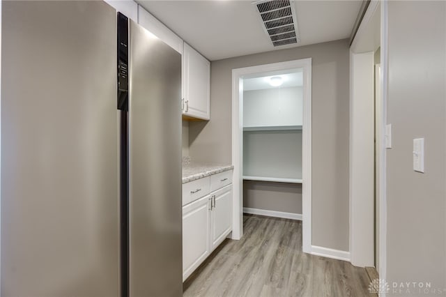 hallway featuring light hardwood / wood-style floors