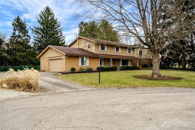 view of front facade featuring a garage and a front lawn