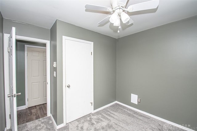 unfurnished bedroom featuring carpet flooring, ceiling fan, and a closet