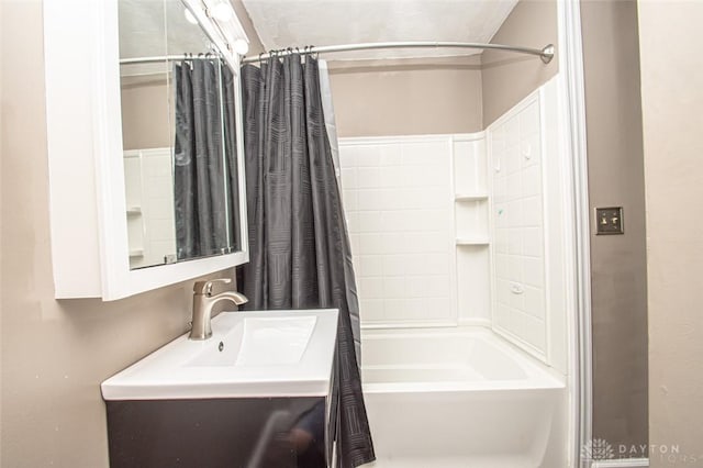 bathroom featuring vanity and shower / tub combo with curtain