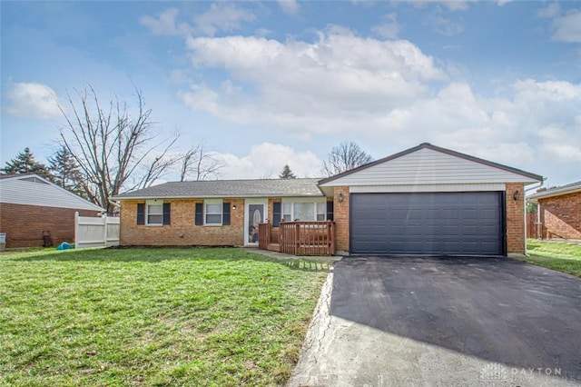 ranch-style home with a garage and a front yard