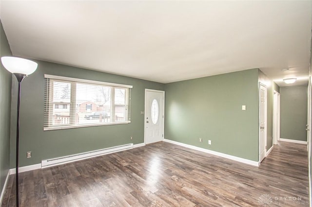 foyer entrance featuring dark wood-type flooring and baseboard heating