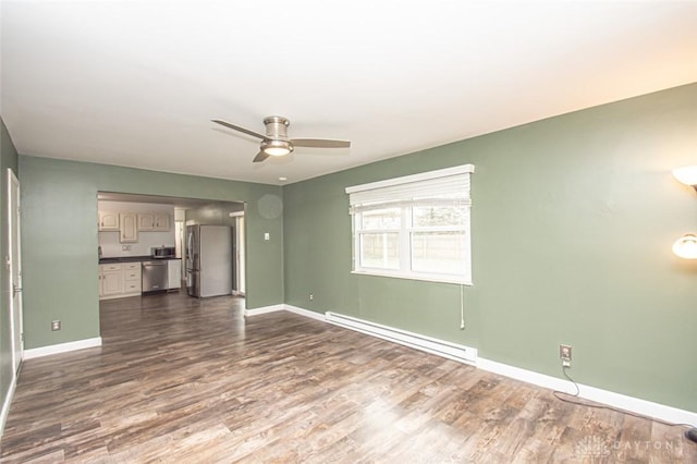 unfurnished living room featuring ceiling fan, hardwood / wood-style floors, and a baseboard heating unit