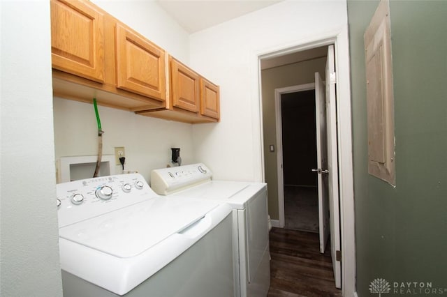 washroom with cabinets, washing machine and clothes dryer, and dark wood-type flooring